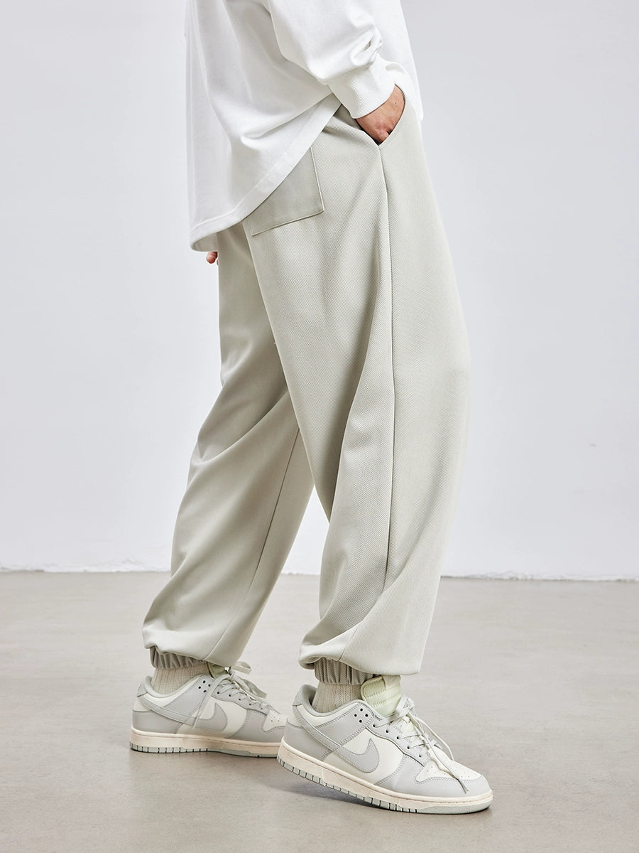 Calças masculinas americanas de cor sólida minimalistas bordadas soltas com faixa no tornozelo